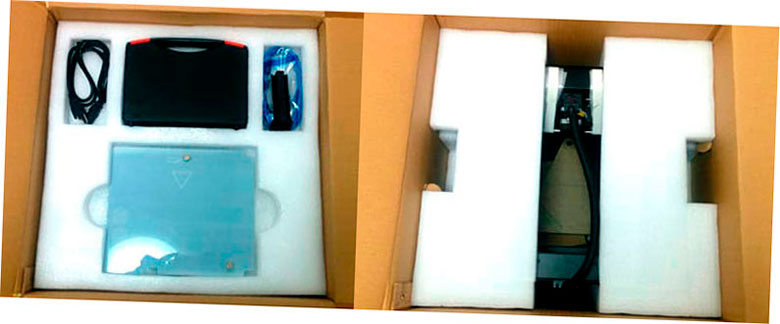 Dentro del embalaje de cartón MBot Grid II Plus. A la izquierda la caja de accesorios, a la derecha la impresora 3D debajo de la primera capa.
